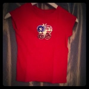 A red shirt with a butterfly